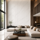 Modern luxury living room featuring large white marble wall panels with soft grey veining, cream sectional sofa, floor-to-ceiling windows, warm wooden accents, and minimalist contemporary interior design.