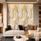 Modern luxury living room featuring a white and gold marble accent wall, cream sectional sofa, warm ambient lighting, and elegant contemporary interior styling.
