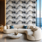 Luxury modern living room featuring a white and charcoal marble accent wall with subtle gold veining, curved cream sectional sofa, marble coffee table, warm ambient lighting, and panoramic ocean views.